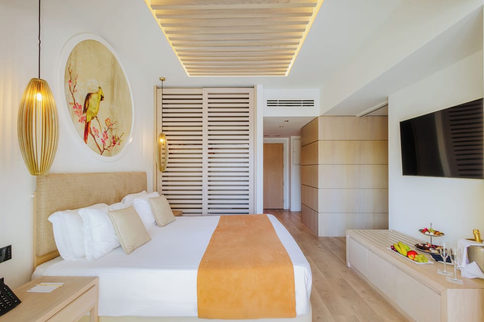 Premium Suite, Partial Sea View | 1 bedroom, in-room safe, desk, laptop workspace