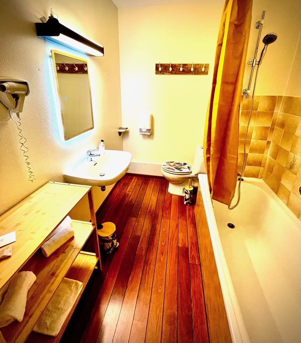 Bathtub, free toiletries, hair dryer, towels