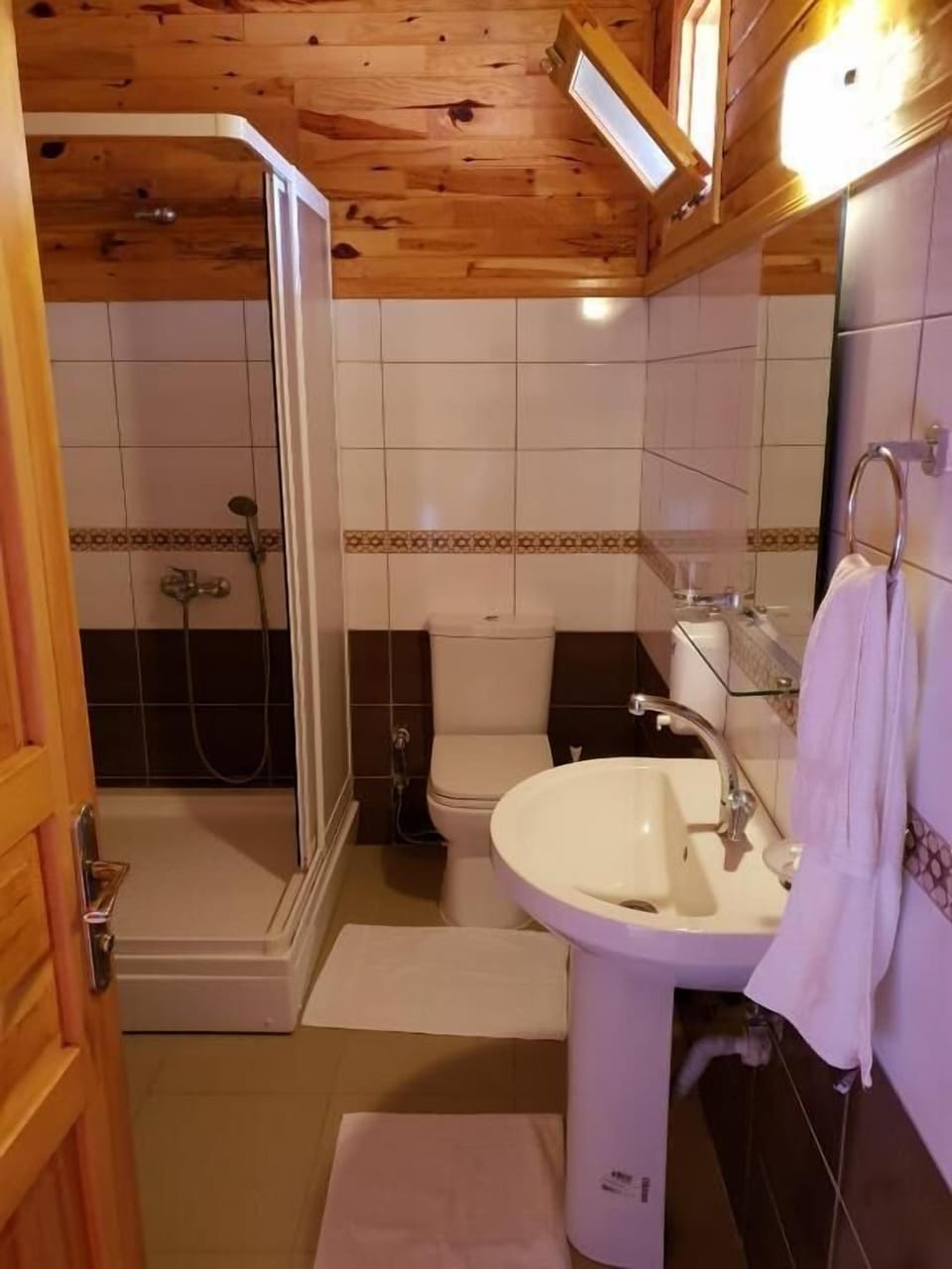 Shower, hair dryer, slippers, towels