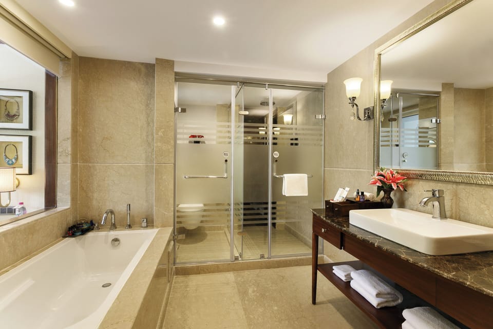 Luxury Suite | Bathroom | Shower, designer toiletries, hair dryer, bathrobes