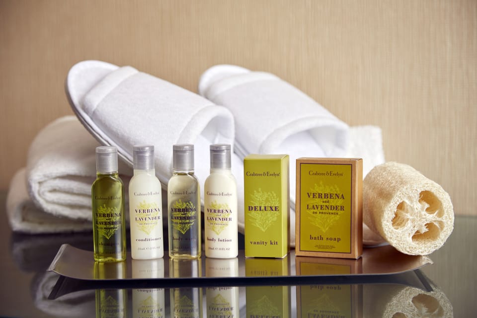 Designer toiletries, hair dryer, towels, soap