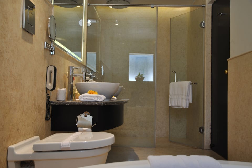 Honeymoon Villa, 1 King Bed | Bathroom | Rainfall showerhead, free toiletries, hair dryer, towels