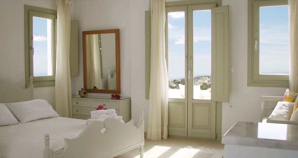 Junior Studio Suite, Sea View | Pillowtop beds, in-room safe, individually decorated
