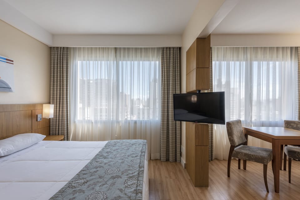 Superior Double Room | Minibar, in-room safe, desk, blackout drapes