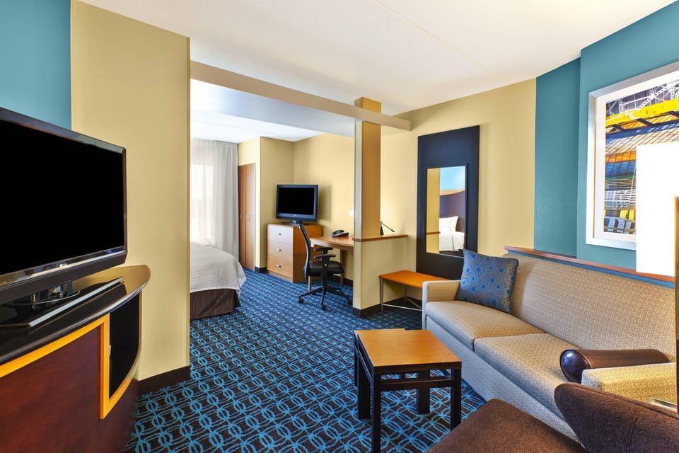 Suite, 1 King Bed with Sofa bed | Desk, laptop workspace, iron/ironing board, free cribs/infant beds