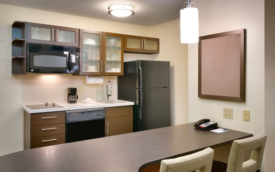 Suite, 1 Bedroom | Private kitchen | Fridge, microwave, stovetop, dishwasher