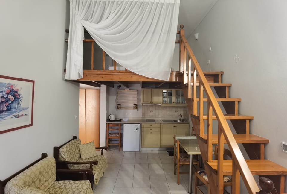 Standard Apartment | Living area | 32-inch flat-screen TV with satellite channels, TV
