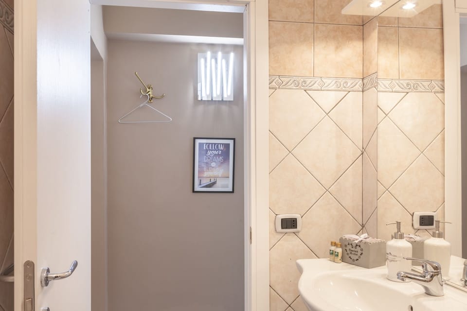 Family Triple Room | Bathroom | Shower, free toiletries, hair dryer, towels