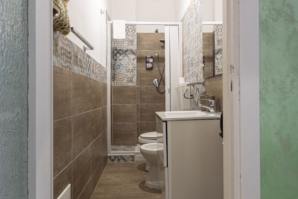 Family Quadruple Room | Bathroom | Shower, hair dryer, bathrobes, bidet