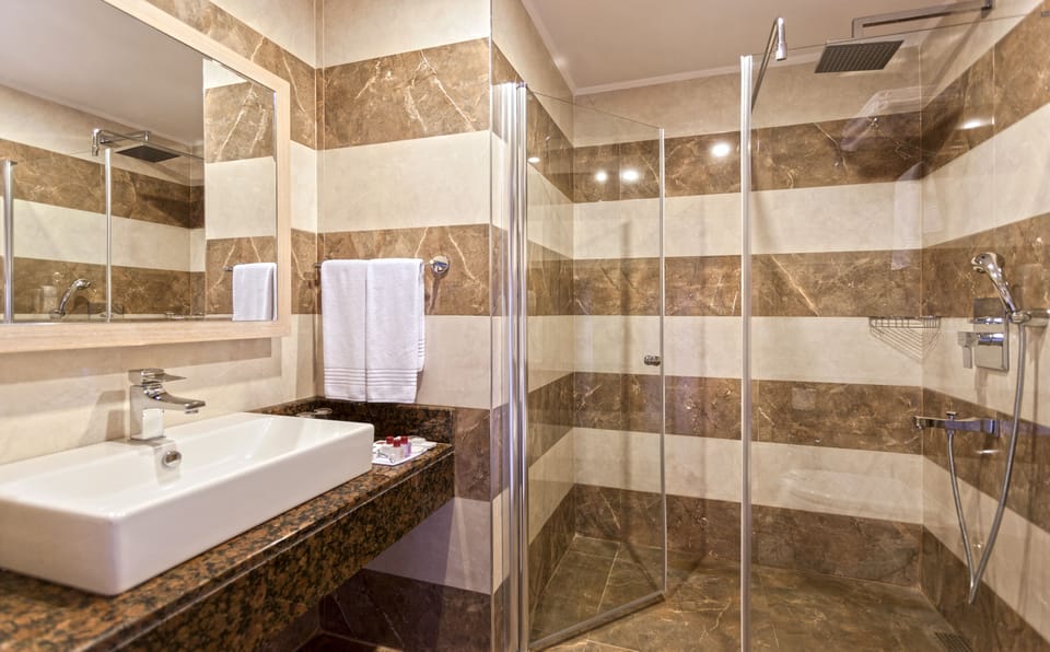 Rainfall showerhead, free toiletries, hair dryer, slippers