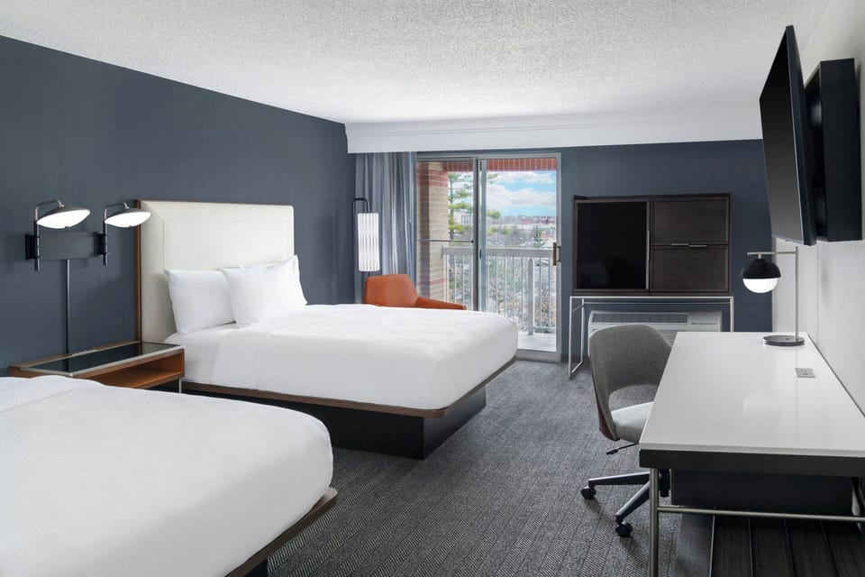 Pillowtop beds, desk, blackout drapes, iron/ironing board