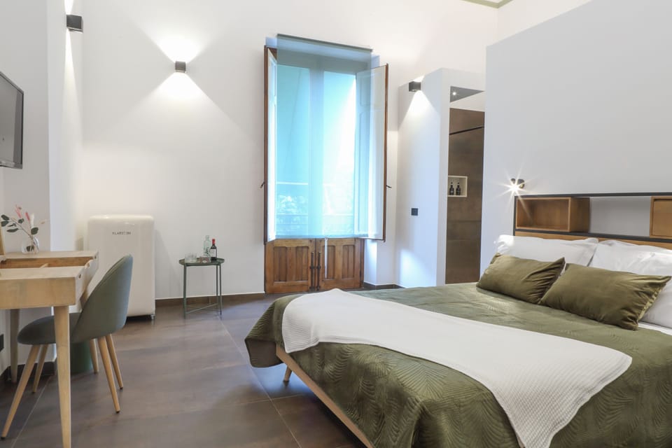 Exclusive Room, 1 Queen Bed, Balcony, City View | 1 bedroom, down comforters, minibar, individually decorated