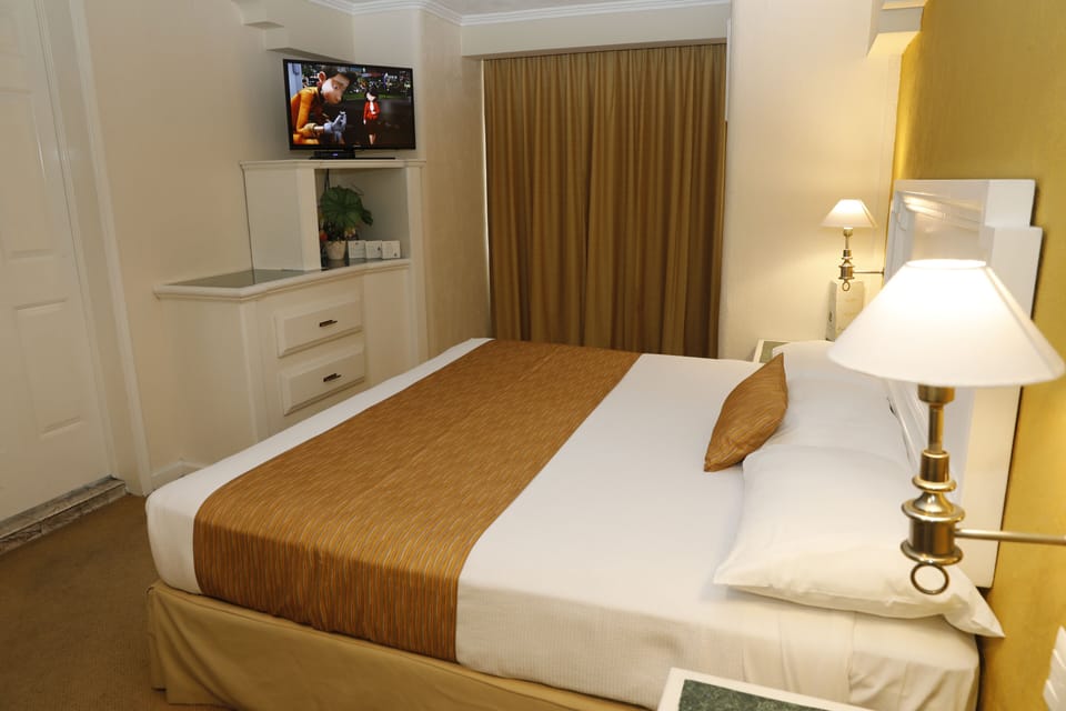Standard Room | Desk, blackout drapes, iron/ironing board, free WiFi