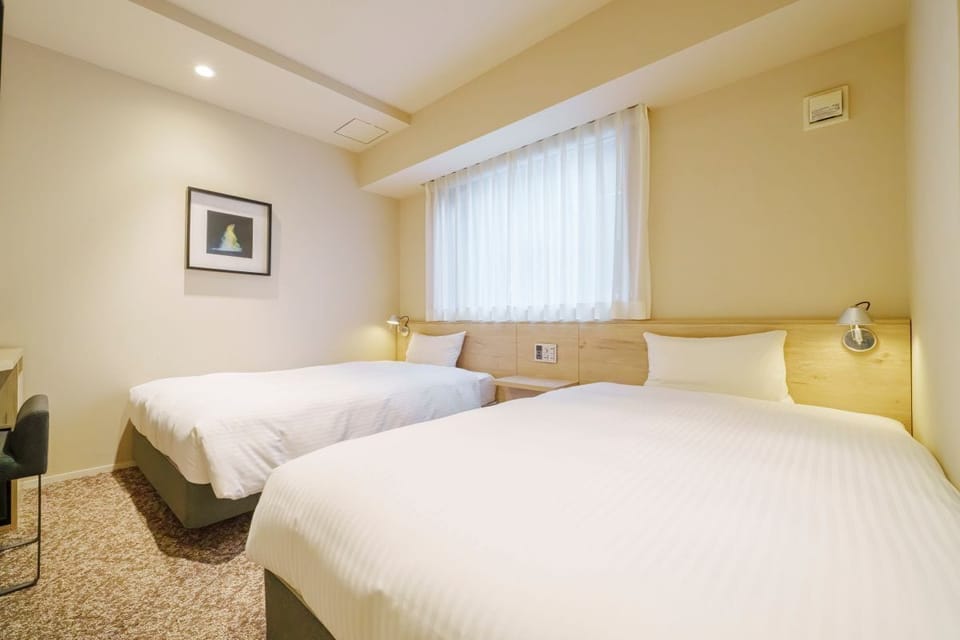 Twin Room (Separate Bathtub and Toilet) | In-room safe, desk, iron/ironing board (on request), WiFi (free)