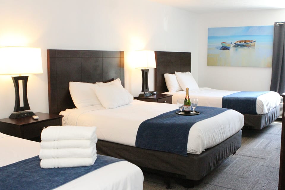 Triple Room (3 Queen Beds) | Desk, iron/ironing board, WiFi (free), bed sheets
