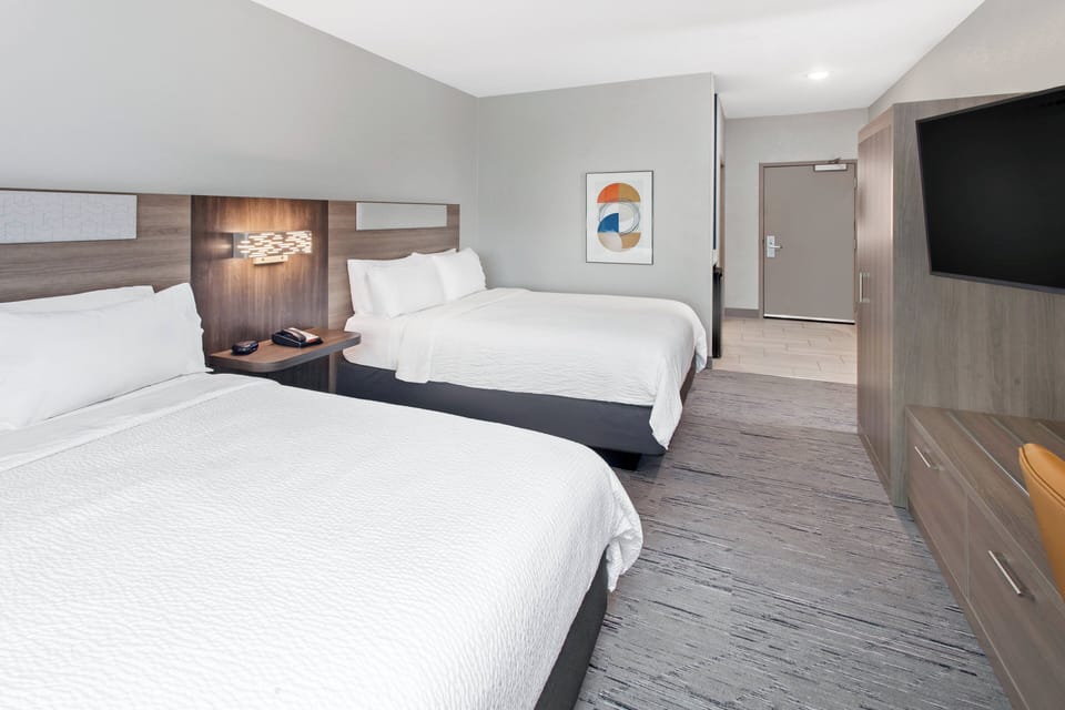 Standard Room, 2 Queen Beds | In-room safe, desk, laptop workspace, blackout drapes