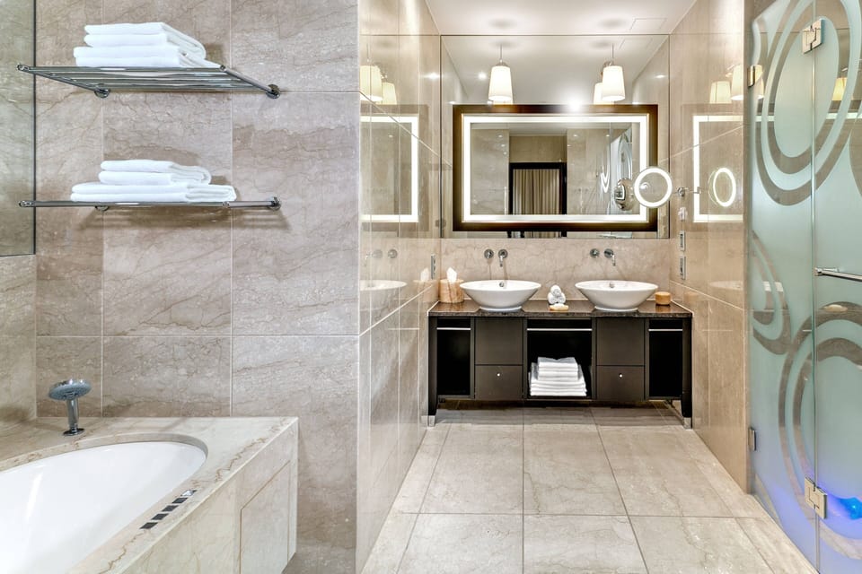 Separate tub and shower, rainfall showerhead, free toiletries