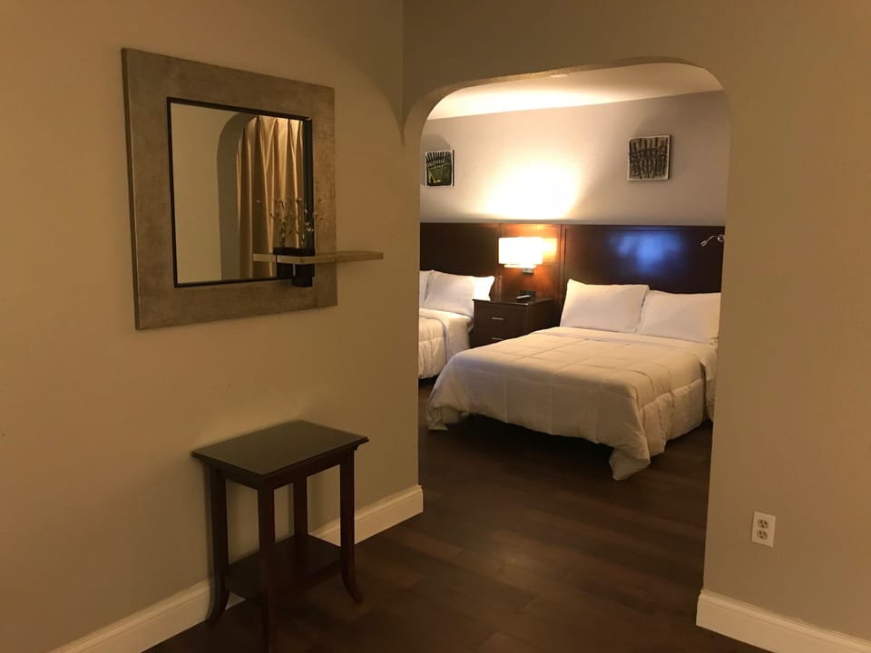 Luxury Suite, 2 Double Beds, Refrigerator & Microwave | Desk, iron/ironing board, free cribs/infant beds, rollaway beds