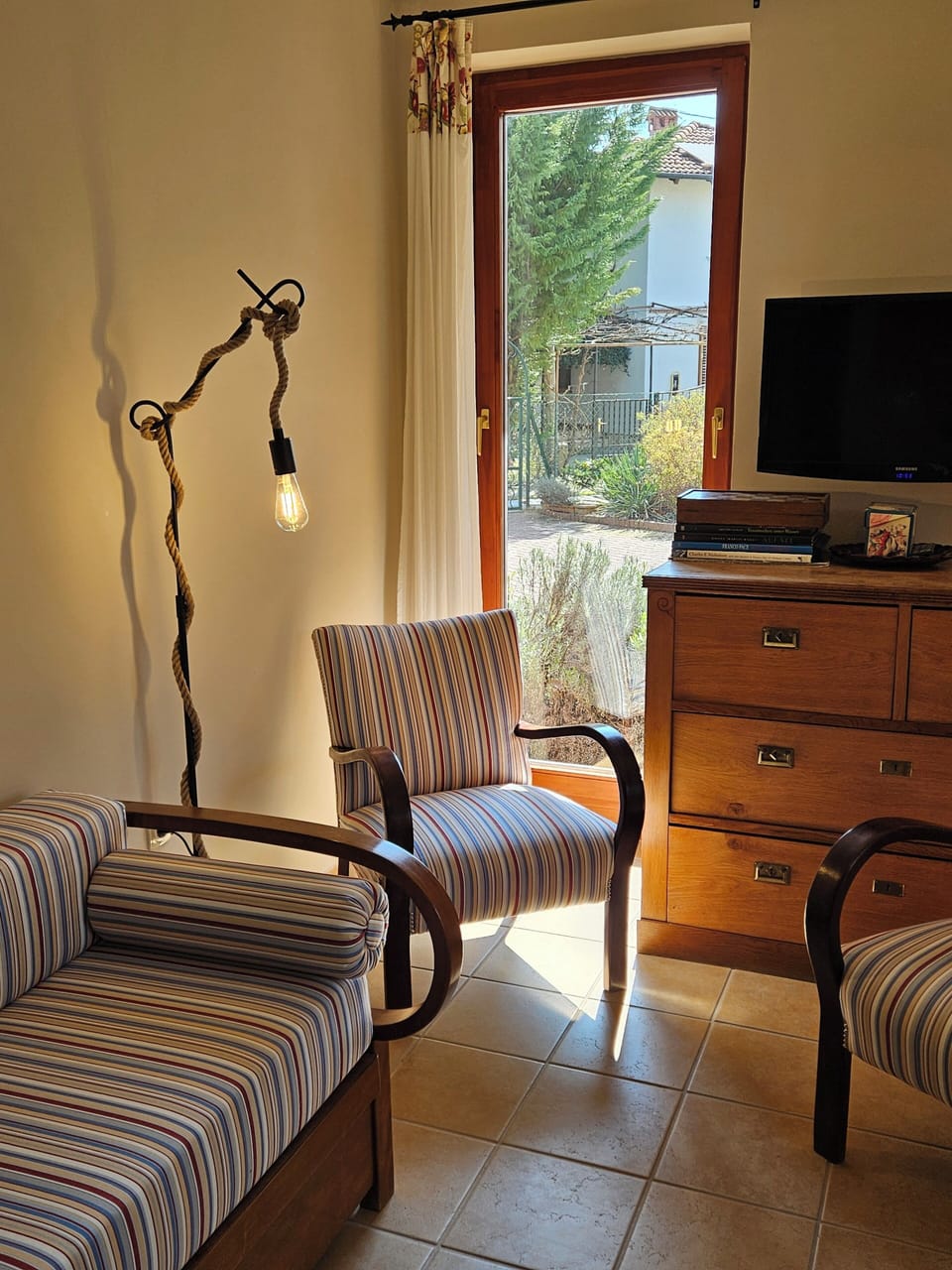 Family Apartment | Living area | 82-cm LED TV with satellite channels, books