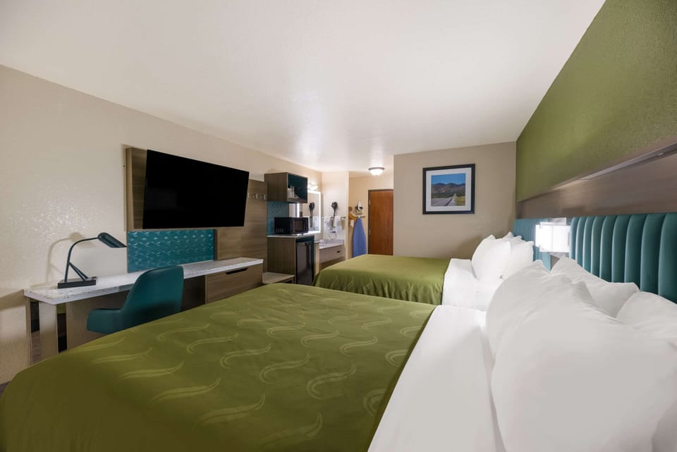 Pillowtop beds, desk, laptop workspace, blackout drapes