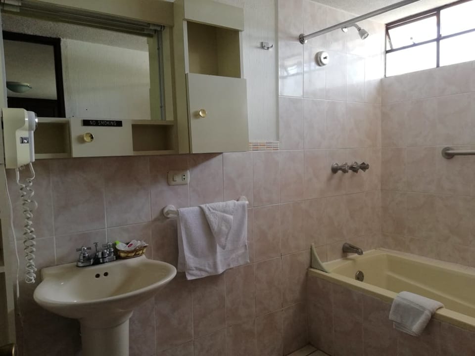 Classic Double Room, 2 Double Beds, Non Smoking, Private Bathroom | Bathroom | Combined shower/tub, free toiletries, towels