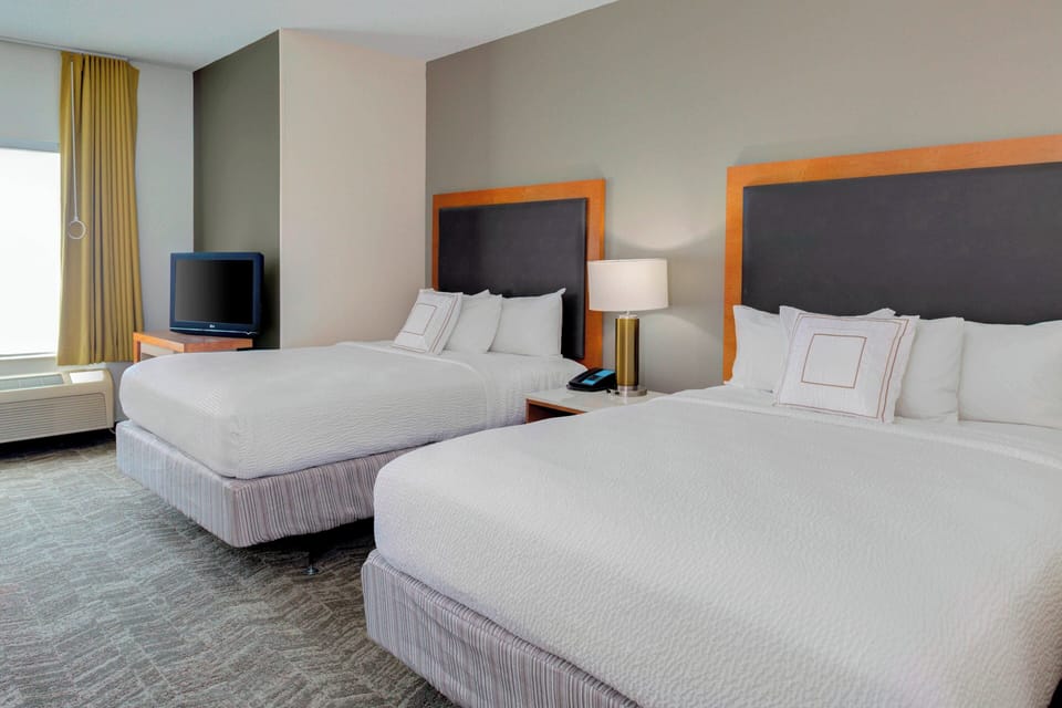 Pillowtop beds, desk, laptop workspace, blackout drapes