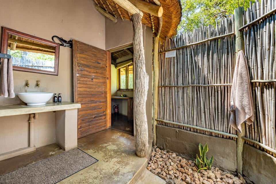 Economy Double Room (Hut 6 - Eco Hut ) | Bathroom | Shower, free toiletries, slippers, towels