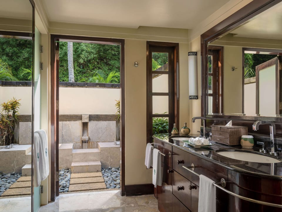 Shower, designer toiletries, hair dryer, bathrobes
