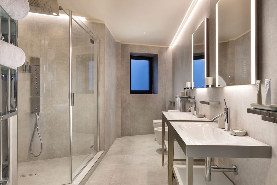 Suite (Silver) | Bathroom | Designer toiletries, hair dryer, bathrobes, slippers