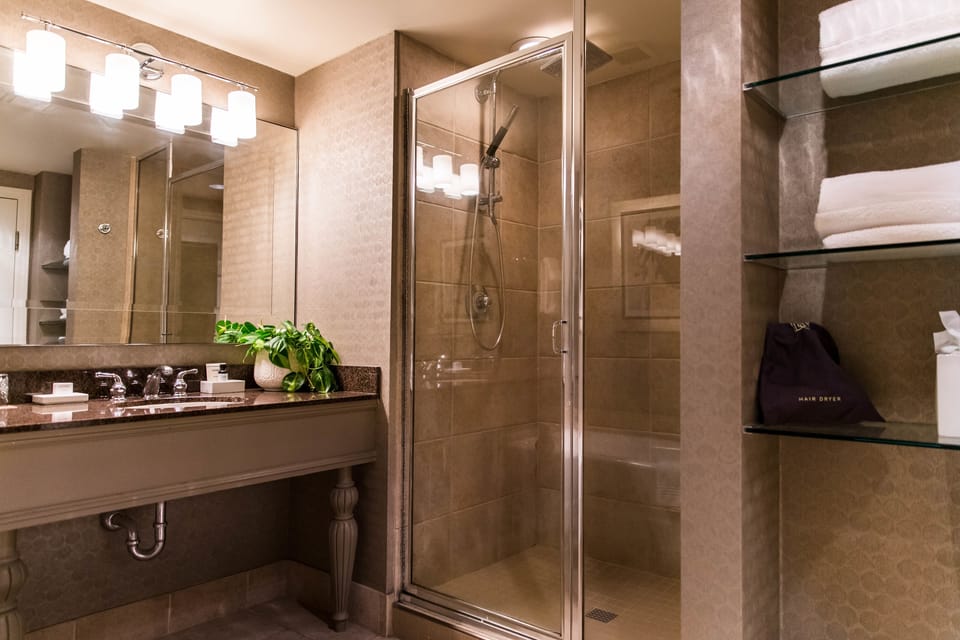 Combined shower/tub, designer toiletries, hair dryer, bathrobes