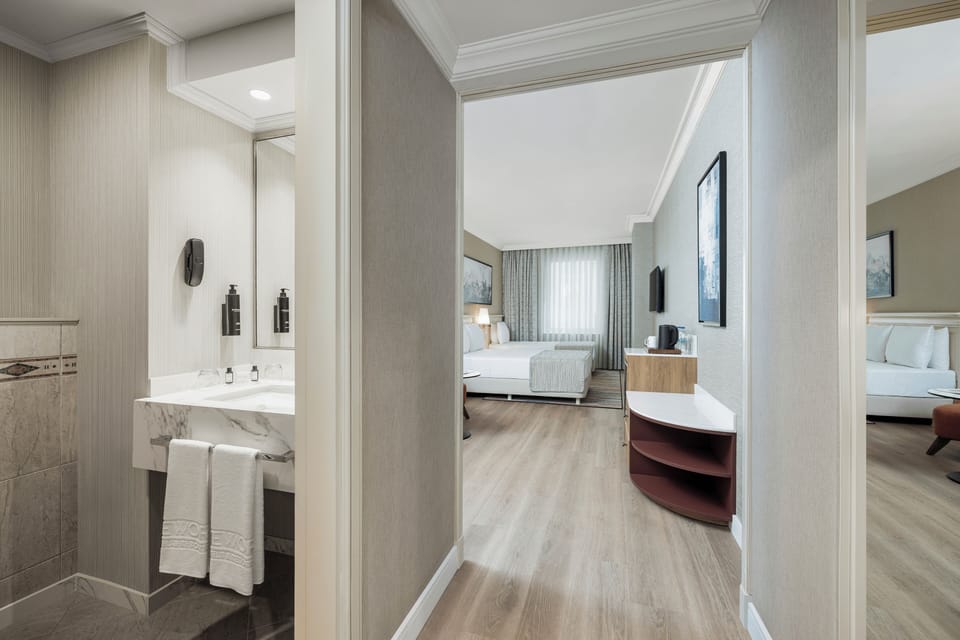 Trendy Triple - 1 King + 1 Single | Bathroom | Shower, hair dryer, towels