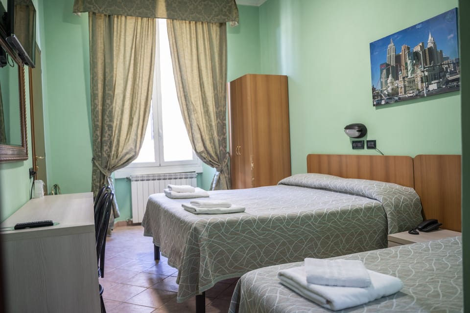 Quadruple Room | Hypo-allergenic bedding, minibar, in-room safe, desk