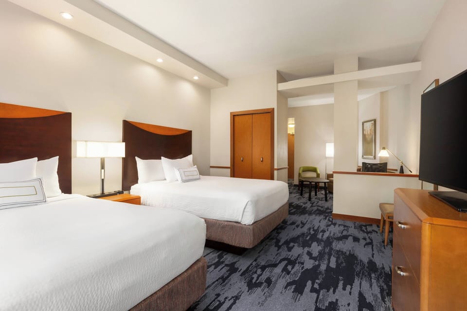 Premium bedding, down comforters, pillowtop beds, desk