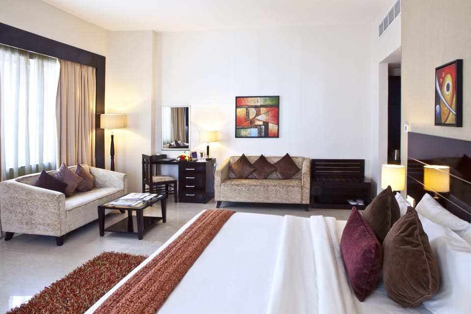 Executive Suite | 1 bedroom, down comforters, minibar, in-room safe