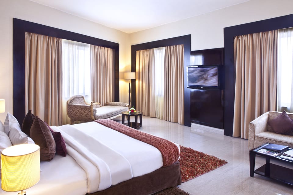 Executive Suite | 1 bedroom, down comforters, minibar, in-room safe
