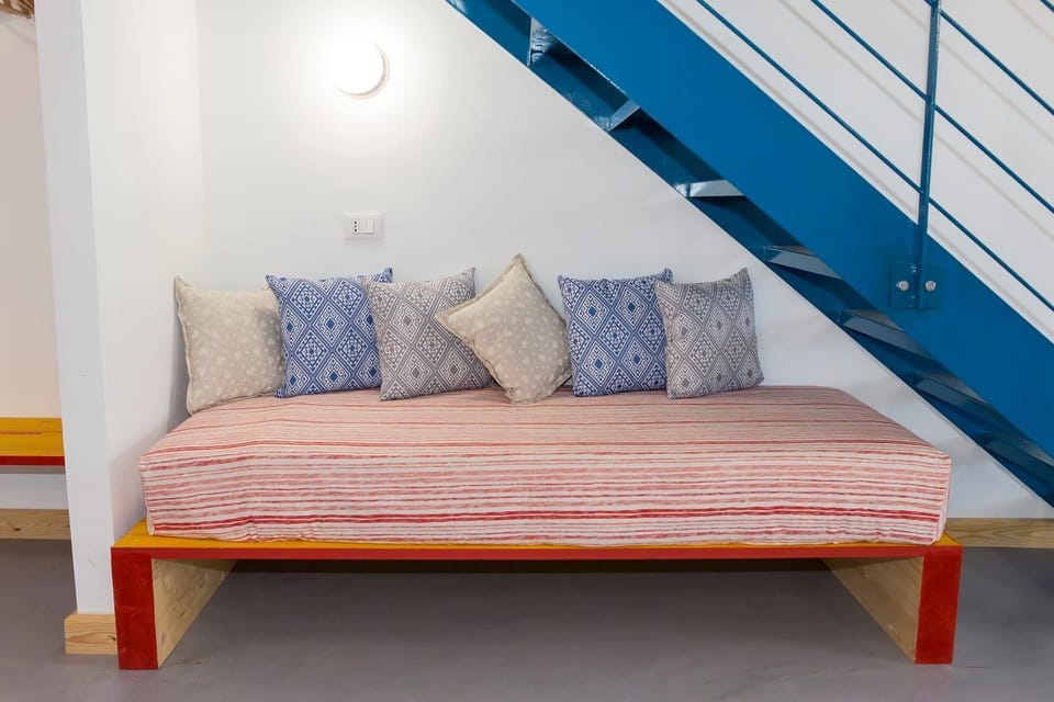Family Quadruple Room | Living area | Flat-screen TV