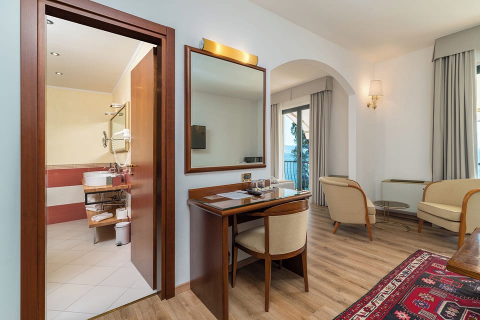 Junior Suite, Lake View | Premium bedding, minibar, in-room safe, desk