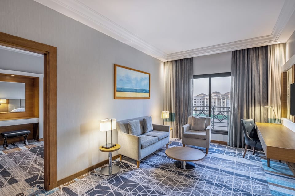 Junior Suite, 1 Bedroom, Smoking | Living area | 43-inch LED TV with satellite channels, TV, pay movies