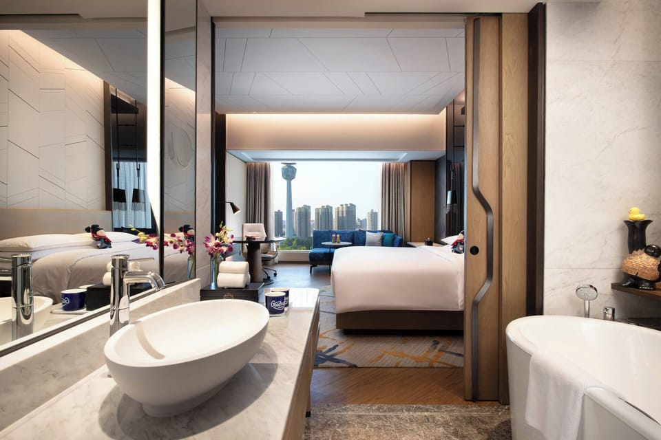 Club King | Bathroom | Deep soaking tub, hair dryer, slippers, towels