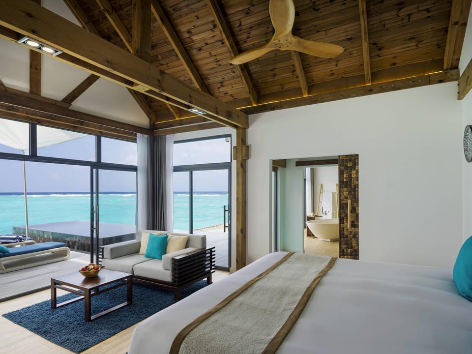 Overwater Pool Villa Sunrise | Memory foam beds, minibar, in-room safe, individually decorated