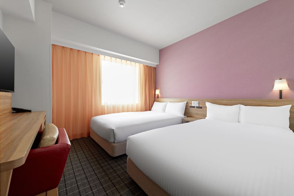 Twin Room, Non Smoking | Down comforters, blackout drapes, iron/ironing board, free WiFi