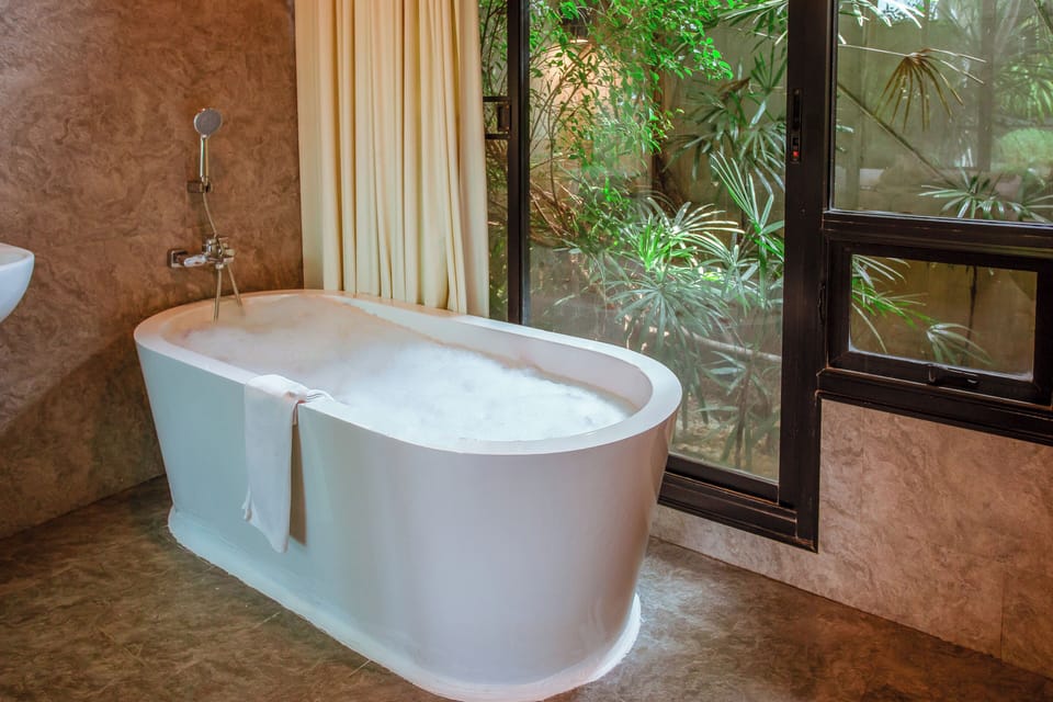 Deluxe Garden Villa | Bathroom | Separate tub and shower, deep soaking tub, free toiletries, hair dryer