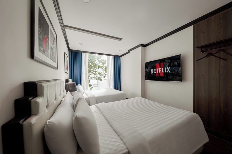 Family Quadruple Room, City View | Minibar, in-room safe, desk, laptop workspace
