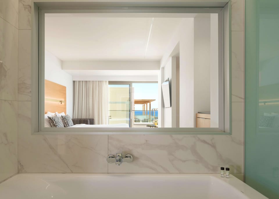 Designer toiletries, hair dryer, bathrobes, slippers