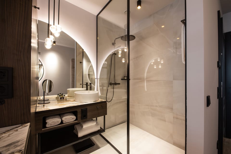 Separate tub and shower, rainfall showerhead, hair dryer, bathrobes