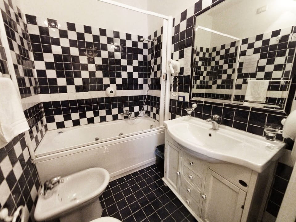 Jetted tub, rainfall showerhead, hair dryer, bidet