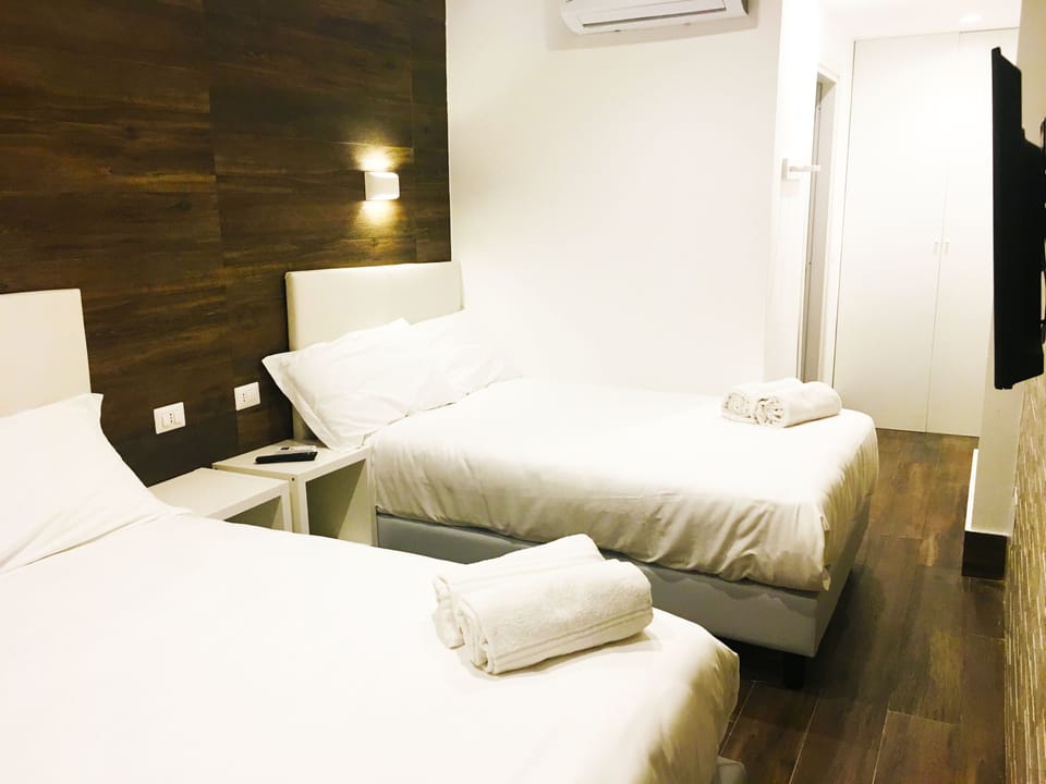 Quadruple Room | Premium bedding, minibar, in-room safe, blackout drapes