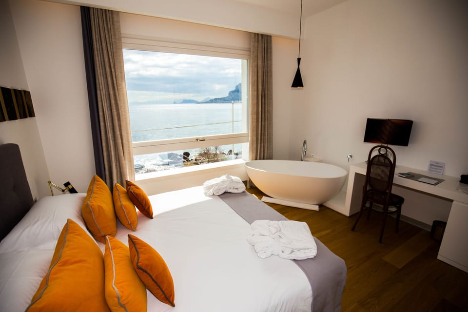 Deluxe Room, Sea View | 1 bedroom, premium bedding, down comforters, memory foam beds