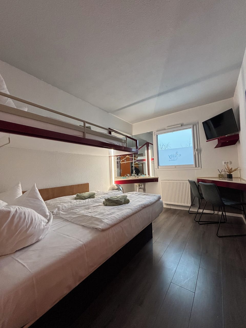 Economy Triple Room | Desk, blackout drapes, free WiFi, bed sheets