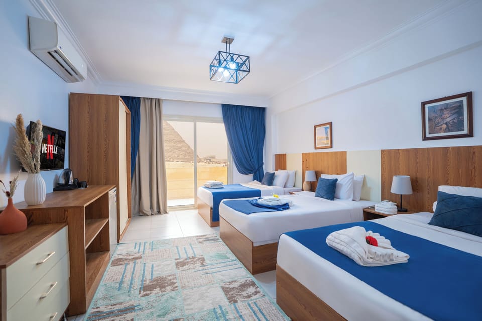Triple Room | Minibar, desk, soundproofing, iron/ironing board